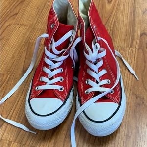 Red Converse high top shoes